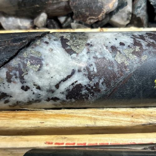 7.84% Cu, 0.21 g/t Au, 57.5 g/t Ag from 392.35m to 392.6m